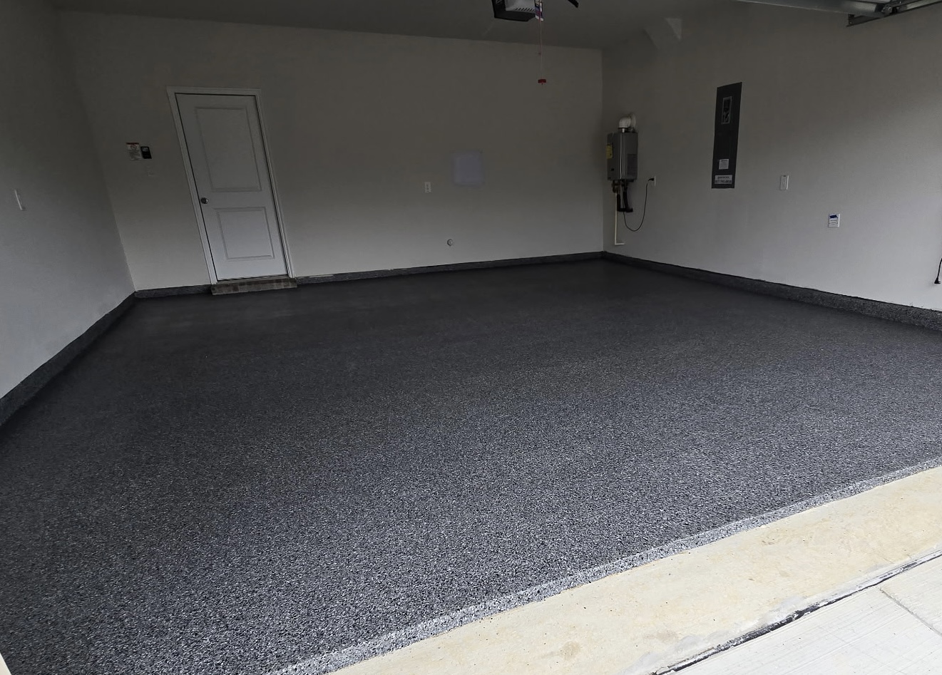 After — Midnight epoxy flake floor finished